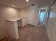 Hallway leads to bedrooms and bathrooms with neutral carpet flooring at 1258 Wispy Cypress Drive Dr, Kissimmee, FL 34746