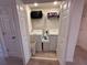 Upstairs laundry closet includes washer and dryer hookups and shelving at 1258 Wispy Cypress Drive Dr, Kissimmee, FL 34746