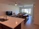 Open concept living room flows from the kitchen and features lots of natural light at 1258 Wispy Cypress Drive Dr, Kissimmee, FL 34746
