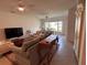 Open living room featuring ceiling fans and plenty of natural light at 1258 Wispy Cypress Drive Dr, Kissimmee, FL 34746