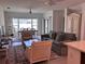 Bright living room area with comfortable seating, ceiling fans, and natural light at 1258 Wispy Cypress Drive Dr, Kissimmee, FL 34746