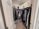Organized walk-in closet with ample hanging space and shelving for storage at 1258 Wispy Cypress Drive Dr, Kissimmee, FL 34746