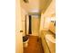 Bright bathroom featuring a shower-tub combo, vanity with countertop and fixtures, and neutral decor at 129 Dogwood Trl, Leesburg, FL 34748