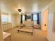 Bedroom includes large window and neutral walls providing a tranquil atmosphere at 129 Dogwood Trl, Leesburg, FL 34748