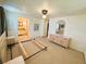 Bedroom includes wall-to-wall carpet and neutral walls creating an airy and relaxing space at 129 Dogwood Trl, Leesburg, FL 34748