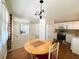 A dining area next to the kitchen featuring views into a living space at 129 Dogwood Trl, Leesburg, FL 34748
