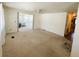Spacious living room with neutral carpet and great natural light at 129 Dogwood Trl, Leesburg, FL 34748