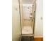 Shower stall with updated showerhead, shelf, and a grab bar for accessibility at 129 Dogwood Trl, Leesburg, FL 34748