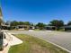 Community street view featuring well-maintained lawns, mature trees, and various homes at 129 Dogwood Trl, Leesburg, FL 34748