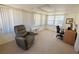 Bright sunroom with ample natural light, a versatile space, and cozy seating at 129 Dogwood Trl, Leesburg, FL 34748