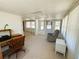 Bright sunroom with ample natural light, versatile space, and a relaxing atmosphere at 129 Dogwood Trl, Leesburg, FL 34748