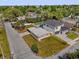 Aerial view highlighting a home with landscaping, a parking area, and surrounding neighborhood streets at 1600 Hart Ln, Orlando, FL 32804
