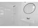 All-white bathroom features a new vanity and shower stall at 1600 Hart Ln, Orlando, FL 32804