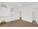 Bright bedroom features open closet space and modern fixtures at 1600 Hart Ln, Orlando, FL 32804