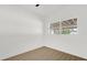 Cozy bedroom features ample sunlight and wood-look flooring at 1600 Hart Ln, Orlando, FL 32804