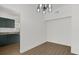 Bright dining room features stylish chandelier and wood-look flooring at 1600 Hart Ln, Orlando, FL 32804