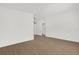 Spacious living room featuring laminate wood flooring and a modern chandelier at 1600 Hart Ln, Orlando, FL 32804