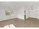 Spacious living room features wood-look floors and natural light at 1600 Hart Ln, Orlando, FL 32804