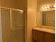 Bathroom boasts double sinks, vanity, shower, and large mirror at 1810 Centennial Ave, St Cloud, FL 34769