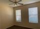 Cozy bedroom with neutral walls and ceiling fan at 1810 Centennial Ave, St Cloud, FL 34769