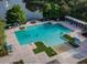 Large community pool with lake views and lounge chairs on the deck at 1810 Centennial Ave, St Cloud, FL 34769