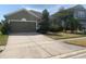 Charming single-Gathering home featuring a well-manicured lawn and an attached two-car garage at 1810 Centennial Ave, St Cloud, FL 34769