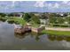 Lakefront community with a wooden fishing pier and gazebo at 1810 Centennial Ave, St Cloud, FL 34769