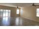 Bright living room features tile floors and sliding doors to the backyard at 1810 Centennial Ave, St Cloud, FL 34769