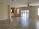 Spacious living room connects seamlessly to the kitchen and features tile flooring at 1810 Centennial Ave, St Cloud, FL 34769