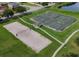 Aerial view of the community's sports courts, including tennis, basketball, and sand volleyball at 1810 Centennial Ave, St Cloud, FL 34769