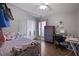 Comfortable bedroom with a bed, closet, desk, and a window offering natural light at 1833 Courtland St, Orlando, FL 32804