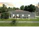 Charming single-story home featuring a well-manicured lawn and a quaint, inviting facade at 1833 Courtland St, Orlando, FL 32804