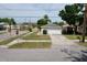 Charming single-story home features a one car garage and a well-maintained front yard and a large driveway at 1833 Courtland St, Orlando, FL 32804
