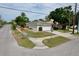 Exterior view of the home featuring an attached garage and corner lot at 1833 Courtland St, Orlando, FL 32804