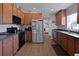 This kitchen features sleek stainless-steel appliances and ample wood cabinetry at 1833 Courtland St, Orlando, FL 32804