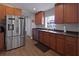 The kitchen features stainless-steel appliances and a view into the backyard at 1833 Courtland St, Orlando, FL 32804