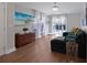 Living room with a comfortable sectional sofa and an art piece of beach scene at 1833 Courtland St, Orlando, FL 32804