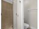 Bathroom featuring a glass enclosed tiled shower and toilet at 1880 Garden Sage Dr, Oviedo, FL 32765