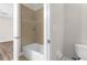 Bathroom featuring a tiled shower and toilet at 1880 Garden Sage Dr, Oviedo, FL 32765