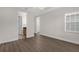 Spacious bedroom features wood floors, a ceiling fan, and ensuite bath at 1880 Garden Sage Dr, Oviedo, FL 32765