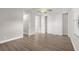 Spacious bedroom features wood floors, ceiling fan, walk-in closets, and ensuite bath at 1880 Garden Sage Dr, Oviedo, FL 32765