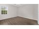 Bright bedroom with large window, modern vinyl floors, and ample natural light at 1880 Garden Sage Dr, Oviedo, FL 32765