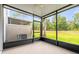 Screened lanai with views of backyard landscaping at 1880 Garden Sage Dr, Oviedo, FL 32765