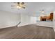 Spacious living room featuring vinyl floors, ceiling fan, and great natural light at 1880 Garden Sage Dr, Oviedo, FL 32765