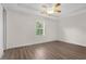 Serene bedroom with ceiling fan, natural light, and durable vinyl flooring at 1880 Garden Sage Dr, Oviedo, FL 32765