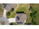 Aerial view of the home with solar panels, well-maintained lawn, and cul-de-sac driveway at 1940 Bell Creek Loop, Fruitland Park, FL 34731