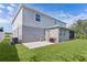 Spacious backyard featuring a screened patio and ample green space, ideal for outdoor living at 1940 Bell Creek Loop, Fruitland Park, FL 34731