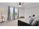 Well-lit bedroom with closet, lamp and comfortable daybed at 1940 Bell Creek Loop, Fruitland Park, FL 34731