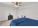 Clean bedroom with white trim, ceiling fan, closet, and neutral carpet at 1940 Bell Creek Loop, Fruitland Park, FL 34731