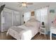Sunlit bedroom with neutral tones, a ceiling fan, and sheer curtains at 1940 Bell Creek Loop, Fruitland Park, FL 34731